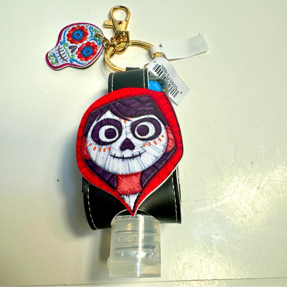 NWT. Disney Pixar Coco hand Sanitizer Holder Keychain bag charm
